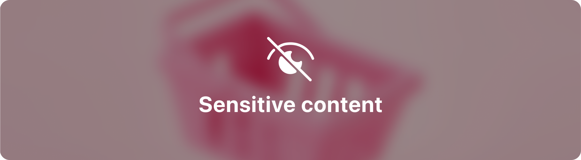 Размытое изображение с пометкой «чувствительный контент»